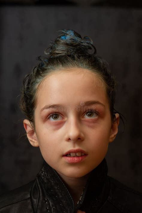 Portrait Of Nine Year Old Girl Teenager With Blue Strands On Her Hair