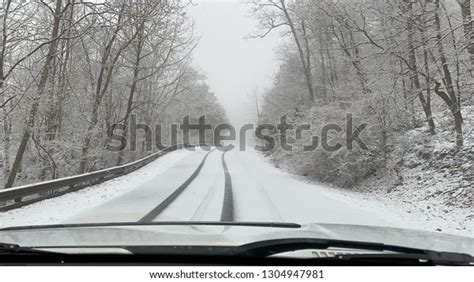 Driving Through Winter Wonderland Forest On Stock Photo 1304947981