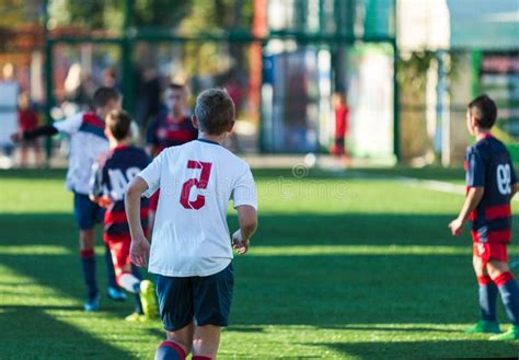 Football Training Soccer For Kids Boy Runs Kicks Dribbles Soccer Balls