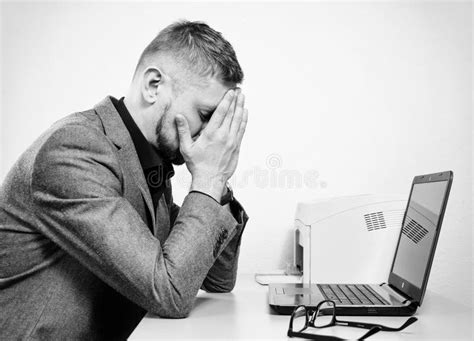 A Tired Man With His Hands On The His Face Stock Photo Image Of Desk