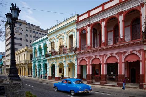 Street Scene With Traditional Colorful Buildings In Downtown Havana And Old American Cars Prado