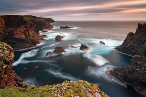 The beautiful coastline of Shetland islands in Scotland during susnet