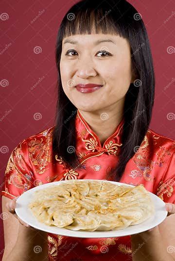Chinese Woman Holding A Plate Full Of Dumplings Stock Photo Image Of