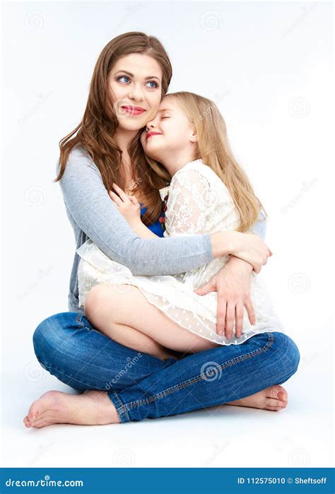 Embracing Mother And Daughter Isolated On White Background Stock Photo