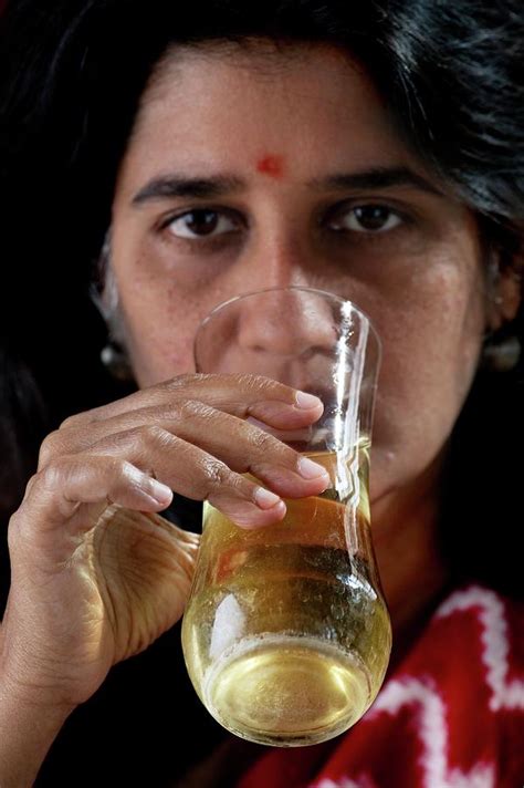 Woman Drinking Urine Photograph By Peter Menzelscience Photo Library