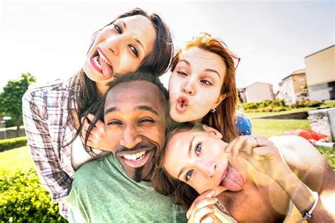 Happy Multiracial Friends Group Taking Selfie Sticking Tongue Out With Funny Faces Young People