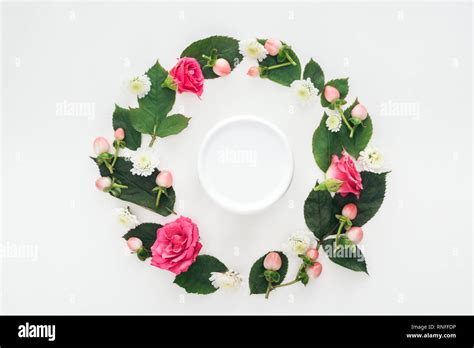 Top View Of Circular Composition With Leaves Flowers And Beauty Cream