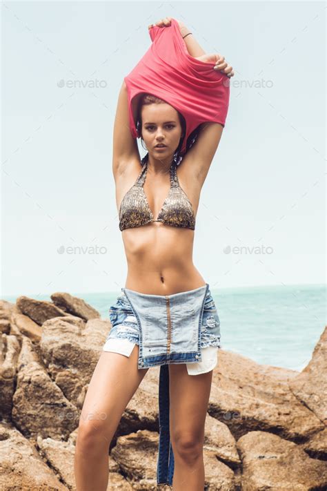 Sexy Girl Undress On Rock Beach Stock Photo By Nikkolia Photodune