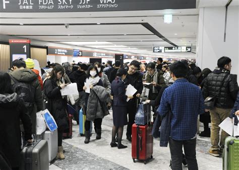 Snow Disrupts New Year Vacationers Flights In Northern Japan