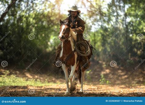 Western Cowboys Riding Horses Are Running At Speed Stock Image Image