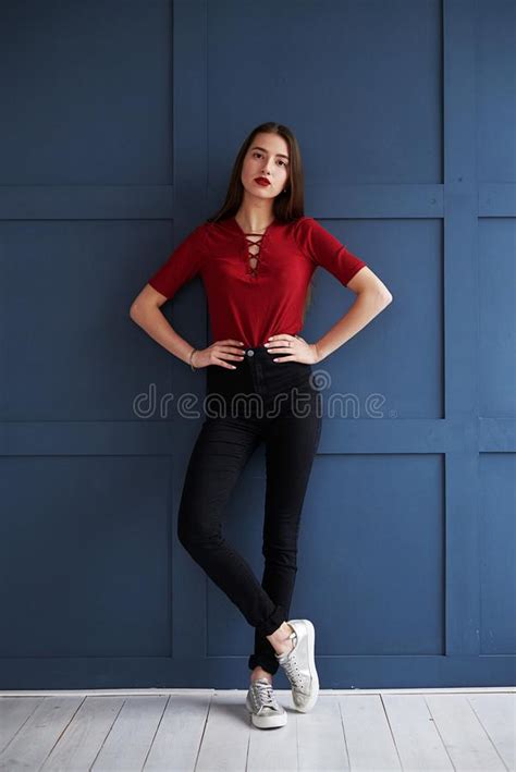 Beautiful Slender Girl With Red Lips Posing Against Background Stock