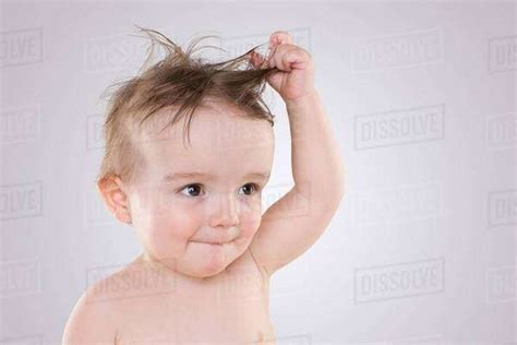 Baby With Tousled Hair Stock Photo Dissolve