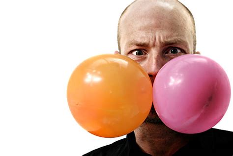 A Man Blowing A Bubble From Chewing Gum Stock Photos Pictures