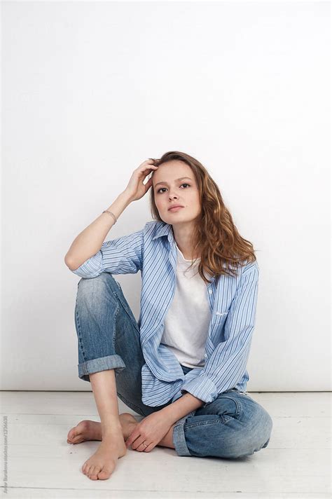 Young Woman Sitting On A Floor By Lyuba Burakova