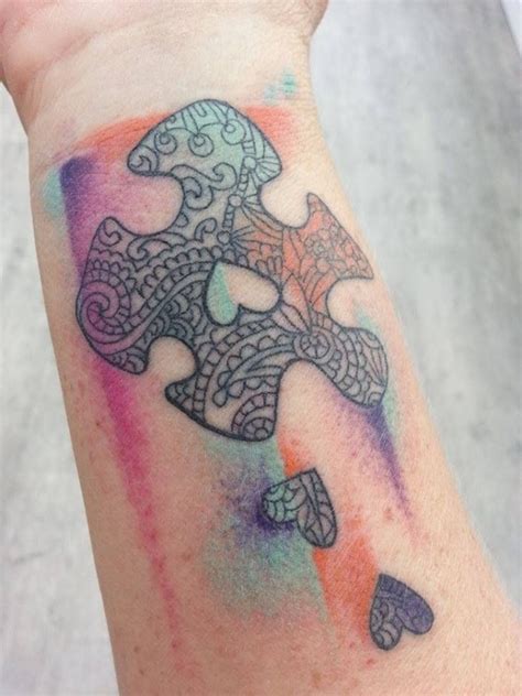 Maybe you would like to learn more about one of these? Heart and colorful puzzle tattoo