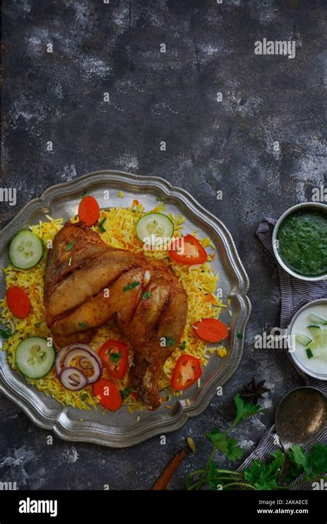 Chicken Kabsa Kuzhi Mandhi Or Mandi Biryani Served With Yogurt Mint