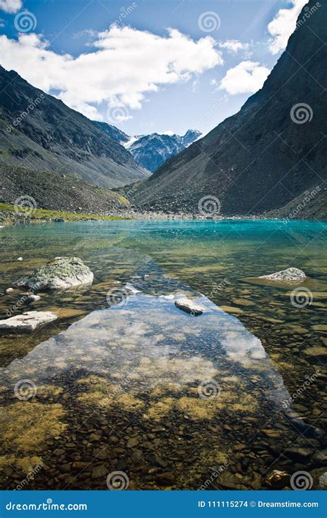 Beautifull Valley With View To Mountains And Turquoise Lake Stock Photo