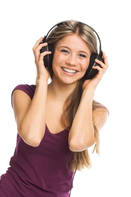 Premium Photo Cheerful Young Woman Listening Music With Headphones On