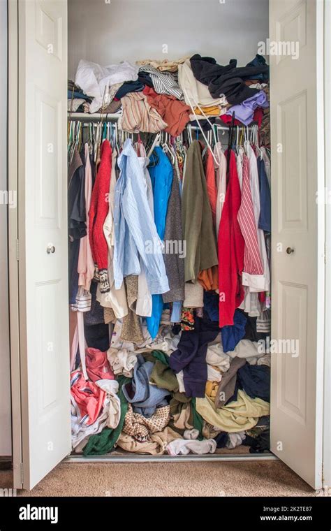 Messy Closet Overfilled With Clothes Stock Photo Alamy