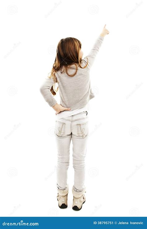 Back View Of Little Girl Points At Wall Rear View Stock Photo Image