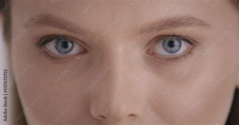 Vidéo Stock Beauty Close up portrait of stunning babe lady with natural blue eyes posing in