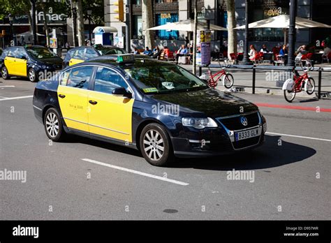 Black And Yellow Taxi Cab In Barcelona City Centre Catalonia Spain