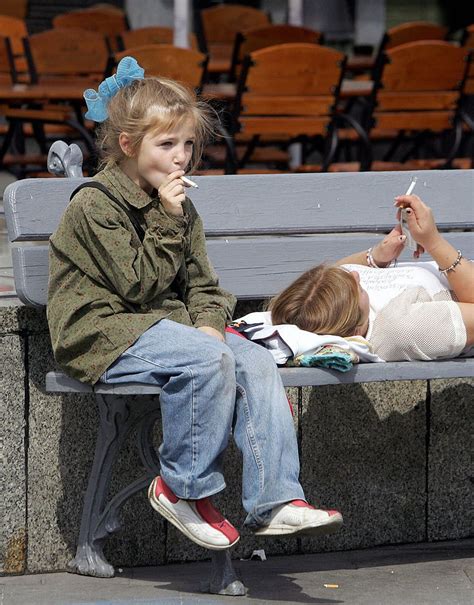 Kiev Ukraine A Girl And Her Mother Smoke Cigarettes On A Bench In The Independence Central