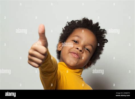 Happy African American Child Boy Showing Thumb Up On White Background