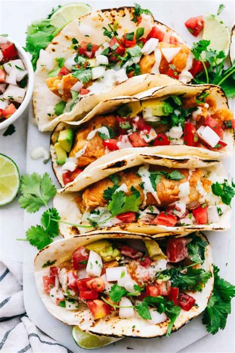 Crispy fried baja fish tacos with crunchy cabbage, fresh pico de gallo, and creamy white sauce all finished with tangy lime! Baja Fish Tacos | The Recipe Critic | BLOGPAPI