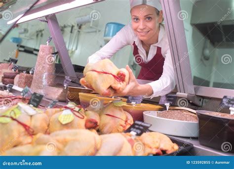 Female Butcher Holding Raw Chicken Stock Image Image Of Smile Animal