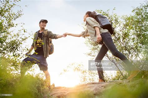 Young Couple Hiking Outdoors Photo Getty Images
