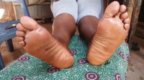 aunty madina s meaty juicy wrinkled oily soles crossed and rubbing together bigsteffs ghana