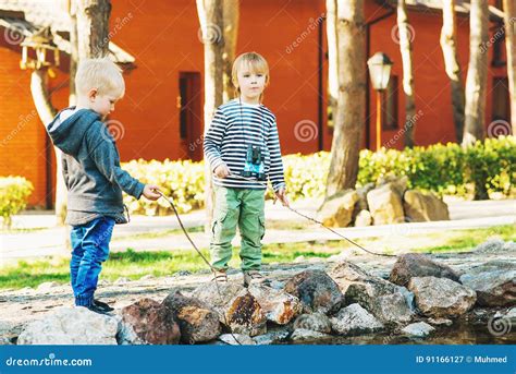 Two Cute Little Boys Playing Outdoor Stock Image Image Of Kids