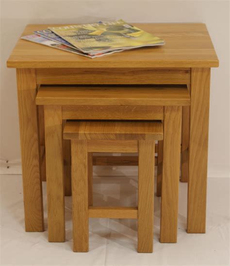 This is nesting coffee table can largely satisfy your demands of having enough space to place your cups, fruits or drinks on it. Gleneagles Nest of Tables - GlenRoss Furniture