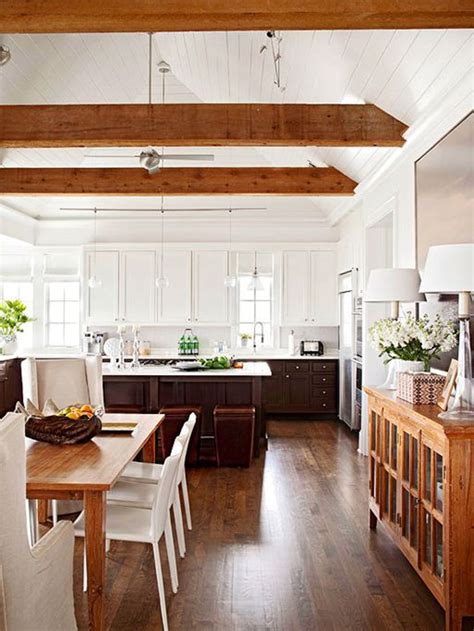 A chalet kitchen all done with reclaimed wood, with exposed wooden beams, bright orange stools, concrete countertops and sleek appliances is chic. 36 Inviting Kitchen Designs With Exposed Wooden Beams ...