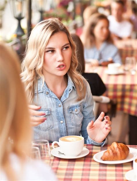 Premium Photo Women At Cafe Drinking Coffee And Talking
