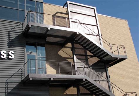 A vertical track at the top of all stairs on each side for the head of a 3/8″ carriage bolt. Prefabricated Metal Staircases | Pinnacle Metal Products