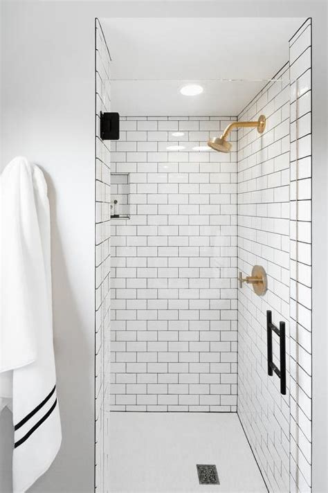And they come in just about every hue you could imagine. White Subway Shower Tiles with Gray Grout and BRushed Gold ...