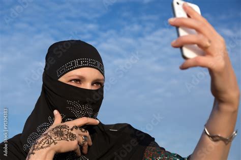 Lady In Black Hijab Holding Telephone Smiling Arabic Woman Dressed In