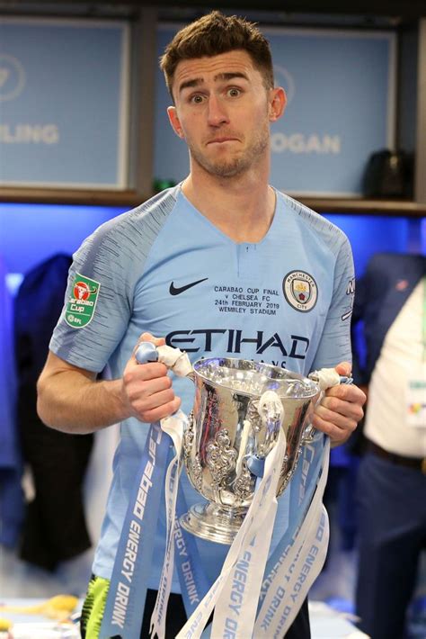 Aymeric Laporte Of Manchester City Celebrates With The Trophy After