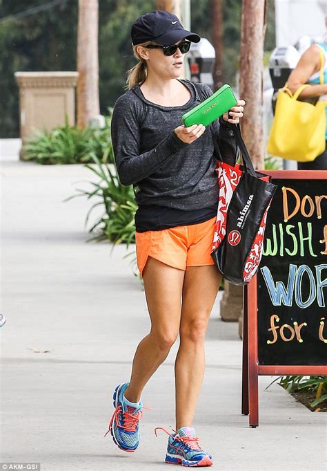 Reese Witherspoon Shows Off Her Toned Legs In Orange Shorts After