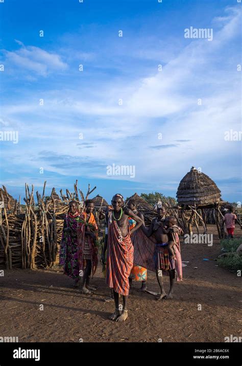 Toposa Tribe People In A Traditional Village With Granaries