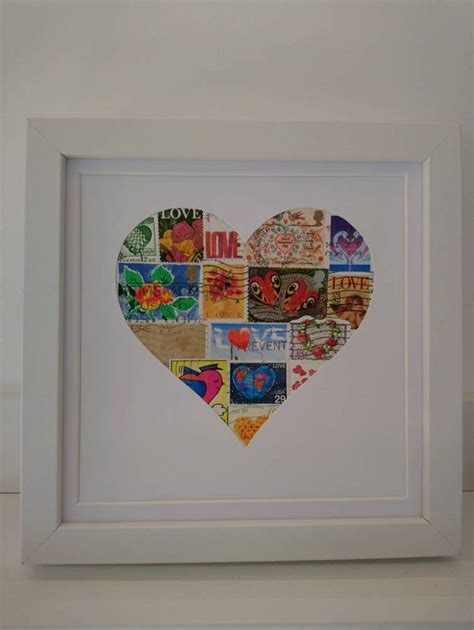A Heart Made Out Of Many Different Types Of Stamps In A White Frame On