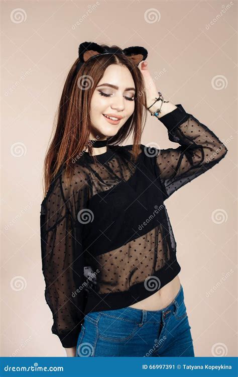 portrait of girl in cat suit on delicate background stock image image