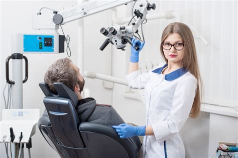 Premium Photo Female Dentist With Microscope Getting Ready For Dental
