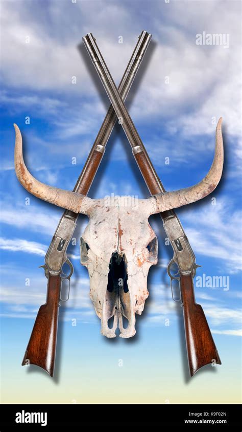 Antique Cowboy Lever Action Rifle And Cow Skulls Stock Photo Alamy