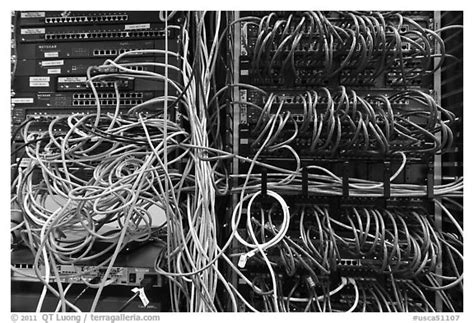 › underground stage › rough stage › electrical stage •from the power company, we get: Black and White Picture/Photo: Unorganized server wires. Menlo Park, California, USA