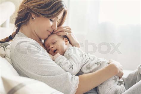 Loving Mom Carying Of Her Newborn Baby At Home Stock Image Colourbox
