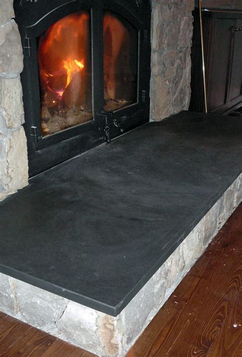 A fireplace is the focal point of your room add a centre piece to your living room so make sure at the stone workshop, we can help in the design process to achieve your ideal fireplace and also offer advise on the best materials to use to match. Black slate Fireplace Hearth - Natural Stone one piece ...