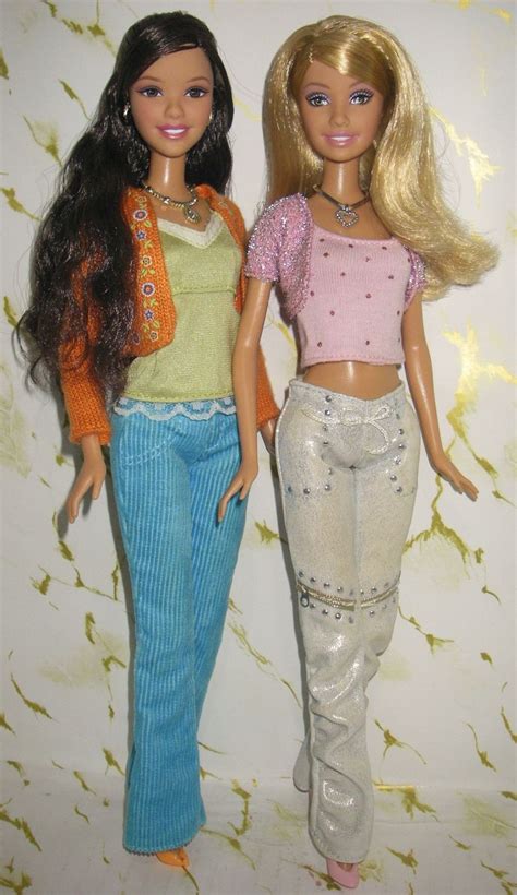 Two Barbie Dolls Standing Next To Each Other